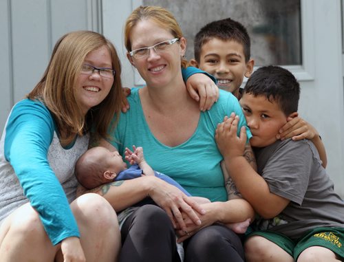 Mom Chloe Lippens  with baby Londuin  Lippens- Gragasan ( not going to camp)  and kids Aliyah Argel, left, Ty Lucero, back, and Talin LuceroSee Jessica Botelho-Urbanski story- Aug 06, 2014   (JOE BRYKSA / WINNIPEG FREE PRESS)