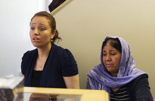 Nafia Naso (left) and her mother Koulan Fandi talk about their family and friends in Iraq who have gone missing. Sarah Taylor / Winnipeg Free Press August 7, 2014