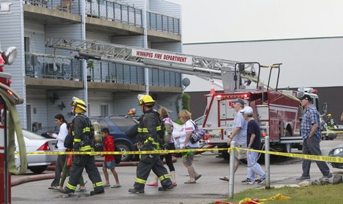 Residents were evacuated from the Adsum Square Apartments on Adsum Drive Friday after a possible lightning strike to the building. Adam Wazny story  Wayne Glowacki/Winnipeg Free Press August 8 2014