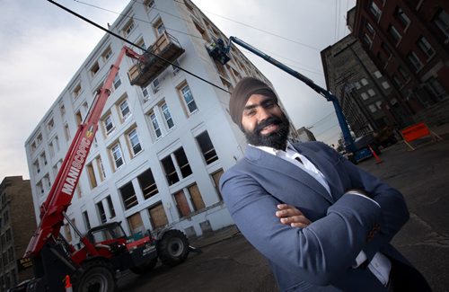 KARAMPAUL SANDHU, owner of Sandhu Developments Inc., which is converting this 6-storey former manufacturing plant (311 Alexander Ave., at Stanley) into an 88-unit apartment block. The project, which involves a complete redevelopment of the interior of the building is  about 50 per cent complete. See story and other photos. See Murray McNeil story. August 8, 2014 - (Phil Hossack / Winnipeg Free Press)