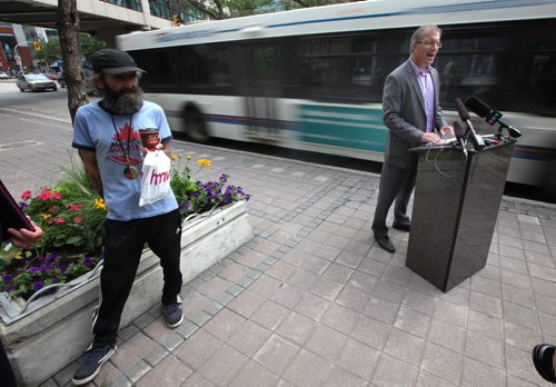 Mayoral candidate Gord Steeves made a downtown policy announcement Friday afternoon on Portage Avenue between Carlton Street and Edmonton. See story and other photos. See Bart Kives story. August 8, 2014 - (Phil Hossack / Winnipeg Free Press)