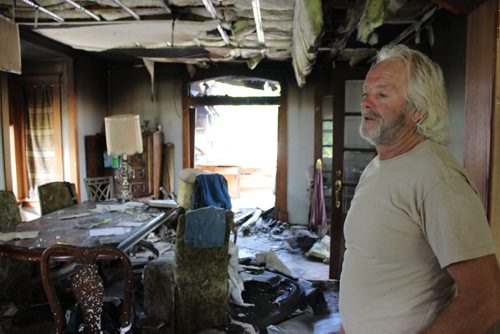 Doug Bergman and the Beausejour landmark he was 90 per cent finished restoring before it burned down July 20. The house is a complete loss. BILL REDEKOP/WINNIPEG FREE PRESS Aug 7,2014