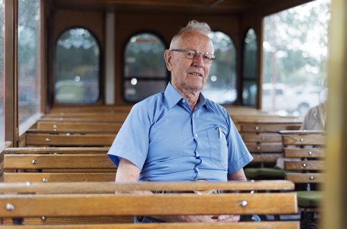 Brian Darragh sits in a trolley at the Forks on Friday. He was a trolley driver for 38 years before retiring in 1992. Sarah Taylor / Winnipeg Free Press August 8, 2014 *for Jessica's story