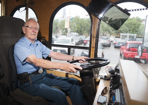 Brian Darragh sits in a trolley at the Forks on Friday. He was a trolley driver for 38 years before retiring in 1992. Sarah Taylor / Winnipeg Free Press August 8, 2014 *for Jessica's story