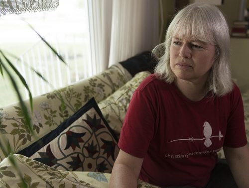 Kathy Moorhead Thiessen, a member of Christian Peacemaker Teams in Iraq, sits in her home as she in on a break and will not return to Iraq until November. Her team is still here. Sarah Taylor / Winnipeg Free Press August 8, 2014