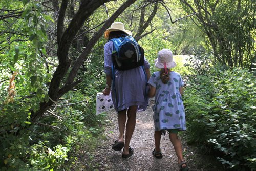 Six-year-old Amelia Miquet and her mother Sarah (Gilbert) make their way to the wetlands and marsh area along the trails at Fort Whyte Alive Centre Saturday morning  to discover the variety of minnows living in the swamps  Saturday morning. Standup photo   Aug 09, 2014 Ruth Bonneville / Winnipeg Free Press