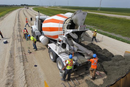 ROAD PROJECT - Cement being poured near on highway 75 south of Winnipeg Near St. Agathe, MB. Dan Lett epic. BORIS MINKEVICH / WINNIPEG FREE PRESS  August 7, 2014