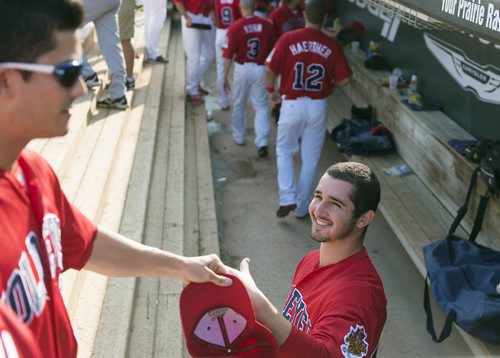 Goldeyes outfielder Sam Kimmel (right) greets Ryan Pineda after the first inning of their game against Wichita Wingnuts on Saturday. Sarah Taylor / Winnipeg Free Press August 9, 2014