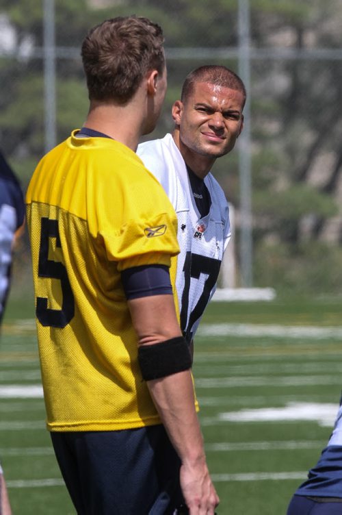 Winnipeg Blue Bombers' Nick Moore (17) and QB Drew Willy (5) talk during practice at Bison Field Sunday afternoon. 140810 - Sunday, August 10, 2014 -  (MIKE DEAL / WINNIPEG FREE PRESS)