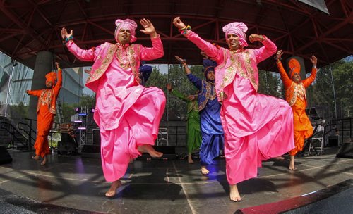 The dance group Hollywood Bhangra performs on the Scotiabank Stage at The Forks during Punjab Day festivities. 140810 - Sunday, August 10, 2014 -  (MIKE DEAL / WINNIPEG FREE PRESS)