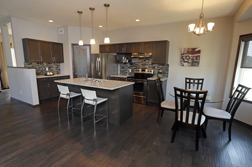 kitchen , eating area .News Homes . 187 Lake Bend Rd. story by Todd Lewys . Aug 11 2014 / KEN GIGLIOTTI / WINNIPEG FREE PRESS