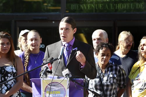 Mayoral candidate Robert-Falcon Ouellette with supporters addresses homelessness and discrimination in Winnipeg Monday in front of City Hall. Kevin Rollason story Wayne Glowacki/Winnipeg Free Press August 11 2014