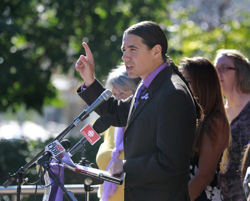 Mayoral candidate Robert-Falcon Ouellette with supporters addresses homelessness and discrimination in Winnipeg Monday in front of City Hall. Kevin Rollason story Wayne Glowacki/Winnipeg Free Press August 11 2014