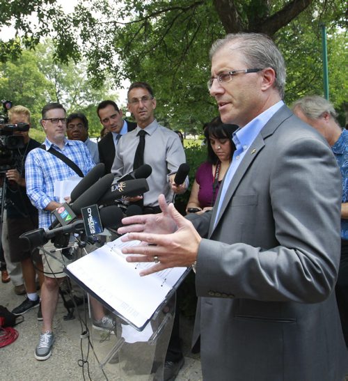 Mayoral candidate Gord Steeves heard questions from the media and individuals attending his announcement Tuesday at Bonnycastle Park. Dan Lett/Kevin Rollason stories Wayne Glowacki/Winnipeg Free Press August 12 2014