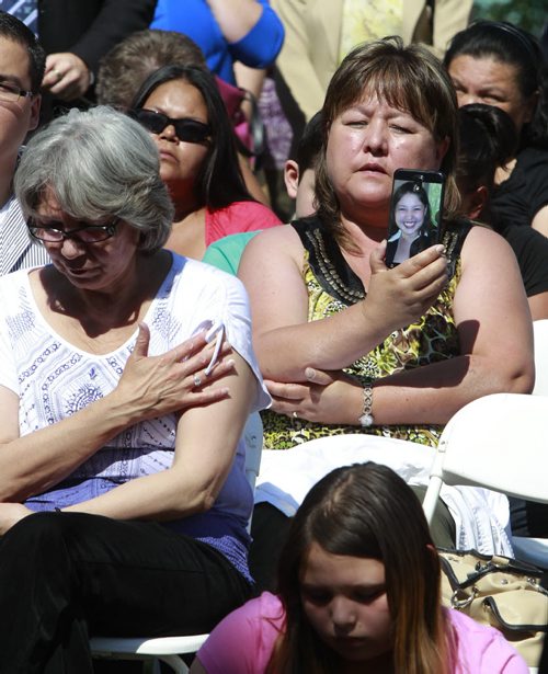About 150 people including family of missing and murdered indigenous women and girls attended¤the monument unveiling by the Oodena Circle at The Forks Tuesday. At the ceremony, Bernice Catcheway holds a photo of daughter Jennifer missing for 6 years. see web story  Wayne Glowacki/Winnipeg Free Press August 12 2014