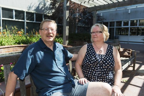 Parkinson's patient Doug Martens sits with his wife Carol at the Health Sciences Centre on Tuesday. Martens was diagnosed with Parkinson's in 2003 and underwent deep brain stimulation surgery in early 2014 and although this is not a cure he says his quality of life has greatly improved.  Sarah Taylor / Winnipeg Free Press August 12, 2014