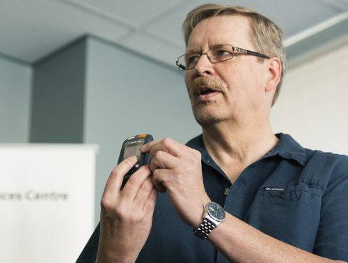 Parkinson's patient Doug Martens holds his device which generates electrical impulses which alleviates the symptoms. Although there is no cure for Parkinson's, his quality of life has improved and he is able more like help around the house. Sarah Taylor / Winnipeg Free Press August 12, 2014