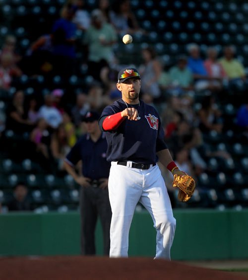 Goldeye third baseman Jake Blackwood tosses a ball in the warm-up Wednesday evening at Shaw Park. See Kyle's story. August 13, 2014 - (Phil Hossack / Winnipeg Free Press)