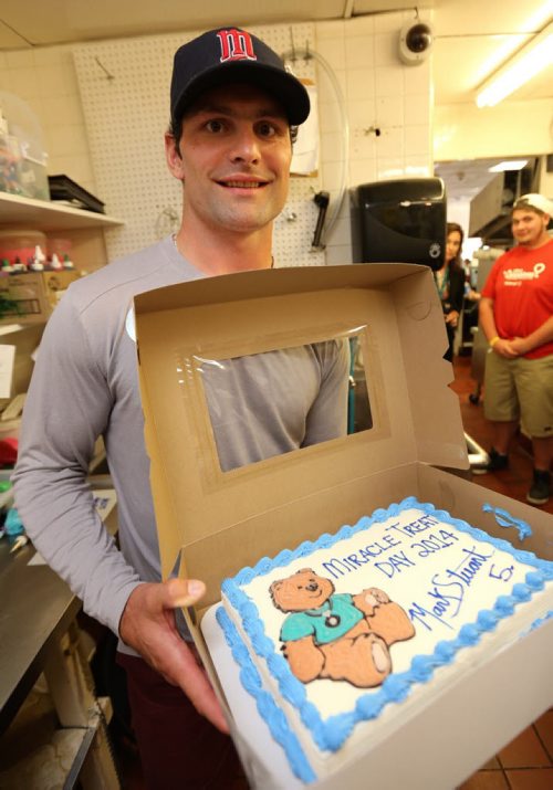 Winnipeg Jets' Mark Stuart autographed an ice cream cake before delivering it to the Children's Hospital at Dairy Queen on Portage Avenue, 2014. (TREVOR HAGAN/WINNIPEG FREE PRESS)