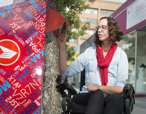 Jesse Turner is concerned with how Canada Post discontinuing their door-to-door delivery and how they will accommodate the disabled. Turner, who  is in a motorized wheelchair is a member of the League of Persons with Disabilities and also works in accessibility at the University of Winnipeg. Sarah Taylor / Winnipeg Free Press August 14, 2014