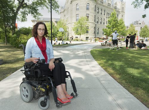Jesse Turner is concerned with how Canada Post discontinuing their door-to-door delivery and how they will accommodate the disabled. Turner, who  is in a motorized wheelchair is a member of the League of Persons with Disabilities and also works in accessibility at the University of Winnipeg. Sarah Taylor / Winnipeg Free Press August 14, 2014