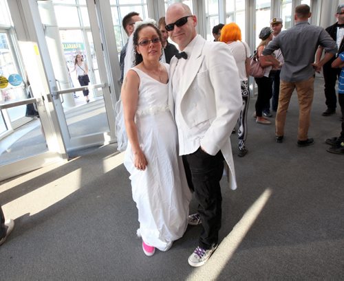 Arcade Fire Fans arrive in "mandatory dress" for a night of song and celebration. August 14, 2014 - (Phil Hossack / Winnipeg Free Press)