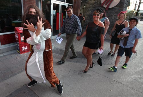 Arcade Fire Fans arrive in "mandatory dress" for a night of song and celebration. August 14, 2014 - (Phil Hossack / Winnipeg Free Press)