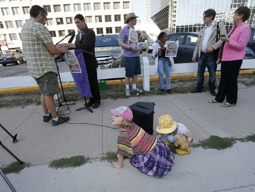 Stdup, Can you hear me now.  Sisters  ,Alice age 7 and Francis Bird age 3 check to make sure  Mayor candidate Robert Falcon Ouellette  sound system is loud enough before he made his announcement on  surface parking in the downtown Friday morning - story by kevin rollason  Aug 15 2014 / KEN GIGLIOTTI / WINNIPEG FREE PRESS