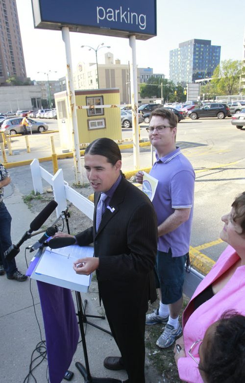 Robert-Falcon Ouellette on Donald Street for his announcement titled Part 2 of Fiscal Plan to put Citys Finances Back on Track, Creating a Better Downtown for Everyone. Kevin Rollason story.Wayne Glowacki/Winnipeg Free Press August 15 2014