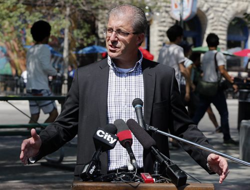 Mayoral candidate Gord Steeves  addressed the media at Old Market Square on King Street, Friday, with a plan to make the Exchange District  a destination centre , high lighting exiting architecture and rezoning , modernizing liquor laws , adding patios and restaurants .  Kevin rollason story Aug 15 2014 / KEN GIGLIOTTI / WINNIPEG FREE PRESS