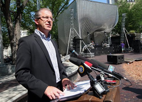 Mayoral candidate Gord Steeves  addressed the media at Old Market Square on King Street, Friday, with a plan to make the Exchange District  a destination centre , high lighting exiting architecture and rezoning , modernizing liquor laws , adding patios and restaurants .  Kevin rollason story Aug 15 2014 / KEN GIGLIOTTI / WINNIPEG FREE PRESS