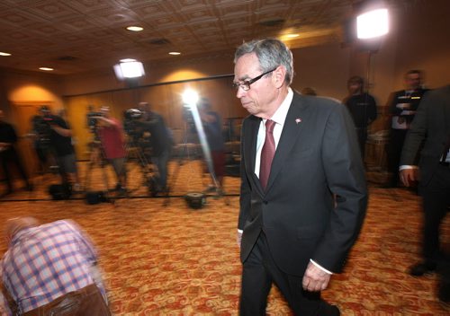 Joe Oliver arrives at a press scrum after his speech to the Manitoba Chambers of Commerce Friday at the Ft Gary Hotel in Winnipeg. See Larry Kusch story. August 15, 2014 - (Phil Hossack / Winnipeg Free Press)