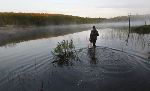 Julian Polimeni,grade 12 student from St. John's-Ravenscourt School  goes out to retrieve his leach traps at day break on Lake # 470. This is part of a school pilot project in the  Experimental Lakes Area (ELA) located past Kenora in Northwestern Ontario. Nick Martin story Wayne Glowacki/Winnipeg Free Press August 14 2014