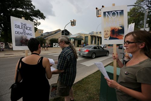 A small silent vigil held outside the Israeli Folklorama Pavillion, in support of peace and justice, Friday, August 15, 2014. (TREVOR HAGAN/WINNIPEG FREE PRESS)