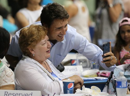 Liberal Party of Canada, Justin Trudeau, taking a selfie with Norma Padilla, at the Israeli Folklorama Pavillion, Friday, August 15, 2014. (TREVOR HAGAN/WINNIPEG FREE PRESS)