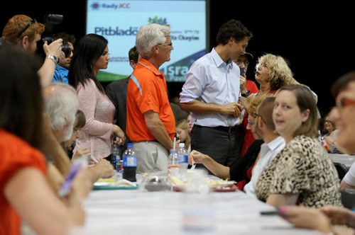 Liberal Party of Canada, Justin Trudeau, right, with Jim Carr,Liberal Candidate for Winnipeg South Centre, meeting with people at the Israeli Folklorama Pavillion, Friday, August 15, 2014. (TREVOR HAGAN/WINNIPEG FREE PRESS)