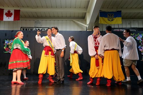 Liberal Party of Canada, Justin Trudeau, posing for a selfie with a member of the Spirit of Ukraine Folklorama Pavillion, Friday, August 15, 2014. (TREVOR HAGAN/WINNIPEG FREE PRESS)