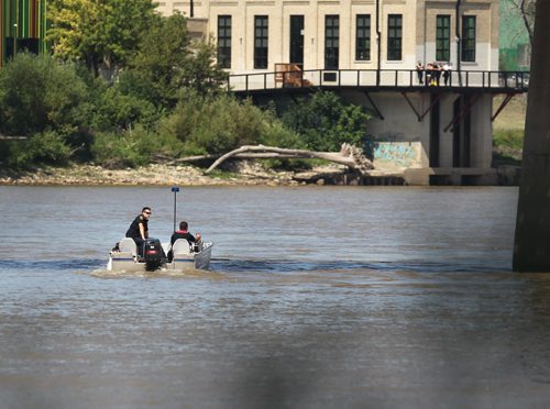 River patrols continue searching just north of the Provencher Bridge Saturday after he went missing in the Red River on Friday afternoon near the Provencher Bridge.    Ruth Bonneville / Winnipeg Free Press