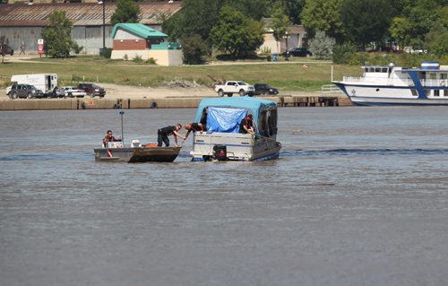 River patrols continue searching just north of the Provencher Bridge Saturday after he went missing in the Red River on Friday afternoon near the Provencher Bridge.   Aug 13, 2014 Ruth Bonneville / Winnipeg Free Press
