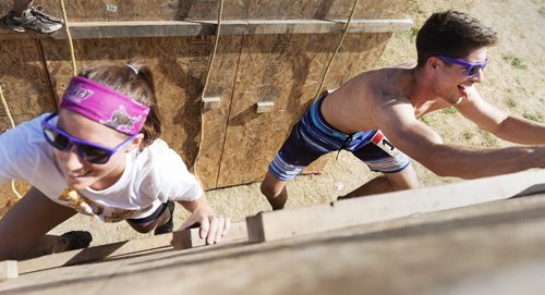 Erin Roach and Alex Mielke climb up the mountain climb during the Mud Run at Springhill Winter Sports Park and Oasis Resort on Saturday. Sarah Taylor / Winnipeg Free Press August 16, 2014