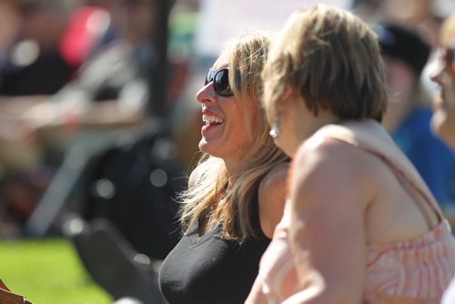 Jan Dumontet is all smiles as she listens to local band The Perpetrators, nominated for the Western Canadian Music Award for Blues Recording of the Year;  at the  3rd Annual Winnipeg BBQ & Blues Festival at Shaw Park Saturday.   The festival takes place August 16th and 17th, and will feature the best in international, national and local blues performers along with the Winnipeg Free Press Pit Masters barbeque competition.  Picture page of photos  Aug 13, 2014 Ruth Bonneville / Winnipeg Free Press
