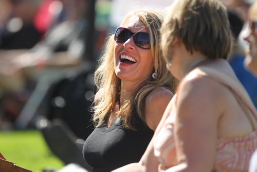Jan Dumontet is all smiles as she listens to local band The Perpetrators, nominated for the Western Canadian Music Award for Blues Recording of the Year;  at the  3rd Annual Winnipeg BBQ & Blues Festival at Shaw Park Saturday.   The festival takes place August 16th and 17th, and will feature the best in international, national and local blues performers along with the Winnipeg Free Press Pit Masters barbeque competition.  Picture page of photos  Aug 13, 2014 Ruth Bonneville / Winnipeg Free Press