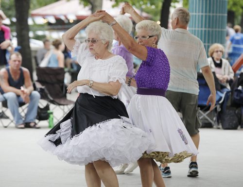 August 17, 2014 - 140817  -   Betty Kernoski (R) and Betty Adams dance the Mission Bell Waltz at Under the Canopy at The Forks, Eastern Manitoba Square and Round Dance Association dance demonstration Sunday, August 17, 2014.  John Woods / Winnipeg Free Press