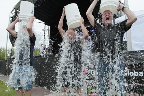 August 17, 2014 - 140817  -   Kevin Donnelly, Senior Vice President, Venues & Entertainment True North, Mayor Sam Katz and Rick Fenton, Producer of Winnipeg BBQ and Blues Festival accept the challenge to take part in the ALS Ice Bucket Challenge at the Winnipeg BBQ and Blues Festival on Sunday, August 17, 2014.  John Woods / Winnipeg Free Press