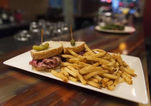 Mike's steamed brisket sandwich with one of five house made mustards and fries at Food Evolution. Sarah Taylor / Winnipeg Free Press August 19, 2014