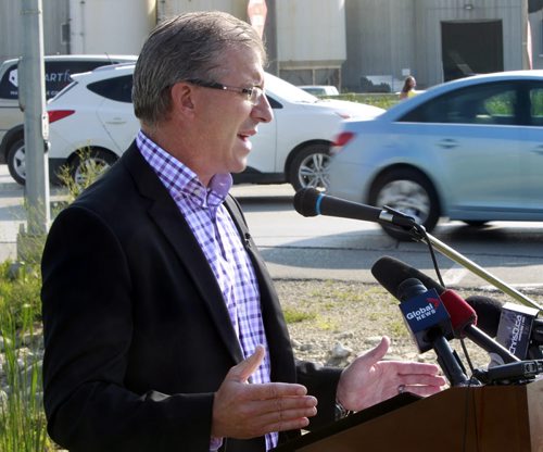 Mayoral candidate Gord Steeves  makes an announcement on Kenaston Blvd. Wednesday morning  with the theme photo radar must focus on safety and fairness.   Bart Kives story.  Wayne Glowacki/Winnipeg Free Press August 20 2014