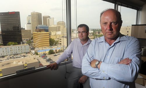 LOCAL - Probe crowd-funding model  .(right) Probe president Scott MacKay and colleague (left rear) Curtis Brown who came up with a crowd-funding model for a public opinion poll on who is leading in the crowded field for mayor. story by Gord Sinclair  Aug 20 2014 / KEN GIGLIOTTI / WINNIPEG FREE PRESS