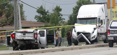 A crash on the Trans Canada Highway at the intersection of Race Track Rd. Thursday morning has closed the east bound lanes. Winnipeg Police on the scene directing traffic. Wayne Glowacki/Winnipeg Free Press August 21 2014