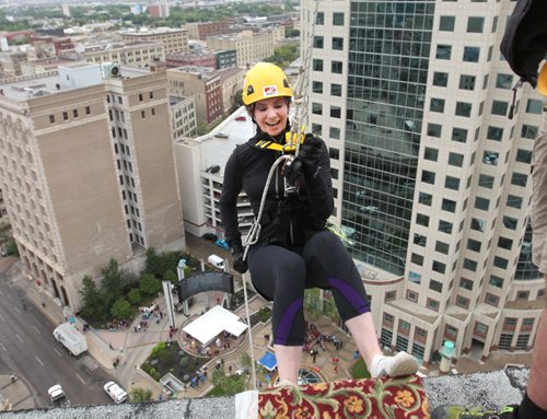 Megan Hemenway is all smiles as she steps off the ledge of the  RBC building just before she rappels down 200 feet during the annual Easter Seals Drop Zone event.  Money raised in the the fundraising event  goes to Manitoban's living with disabilities.   Standup photo Aug 21, 2014 Ruth Bonneville / Winnipeg Free Press