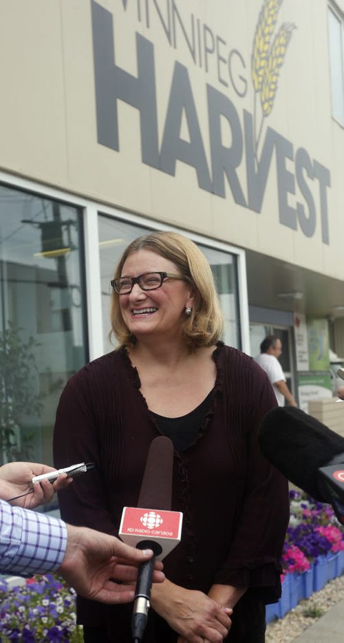 local - Paula Havixbeck at Winnipeg Harvest , Campaign announcement on community activism . Section/reporter: City/santin Aug 21 2014 / KEN GIGLIOTTI / WINNIPEG FREE PRESS